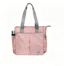 Pink tote diaper bag with gray handles on a white background